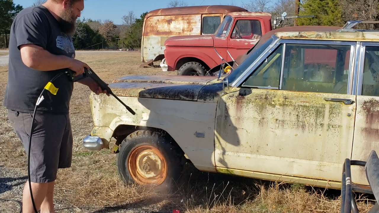 1965 Jeep Wagoneer power washed after 20+ years.