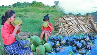 Woman with girl lost hut &amp; cook snail with water spinach