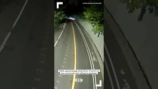 Traffic camera footage shows driver of sports car lose control and crash, killing her passenger