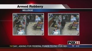 Surveillance photos released of armed robbery suspect
