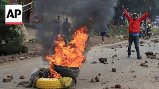 Protesters in Kenya light bonfires during public transport strike over fuel prices