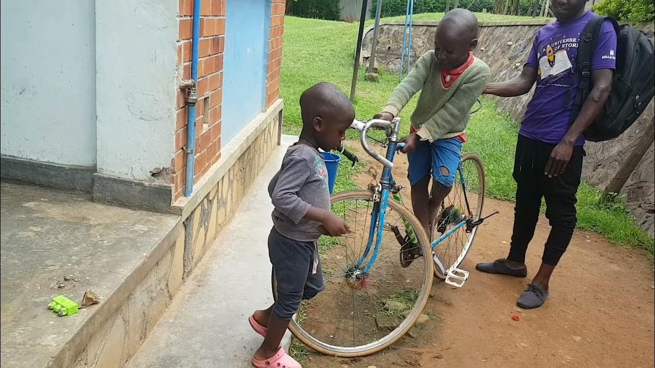 Cuthbert Winner with his brother Victor M Vlad enjoying bicycle riding