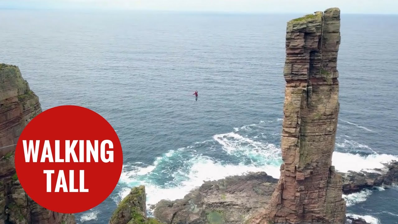 Daredevil walks tightrope from on of Britain's tallest sea stacks