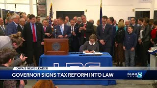 Gov. Kim Reynolds signs tax reform into law