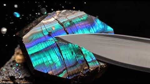 Ultra-sharp blade slowly slices gemstones and minerals, showcasing truly realistic cracks and textur