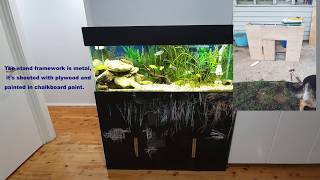 Custom made aquarium stand painted with chalkboard paint and fish tank african cichlids