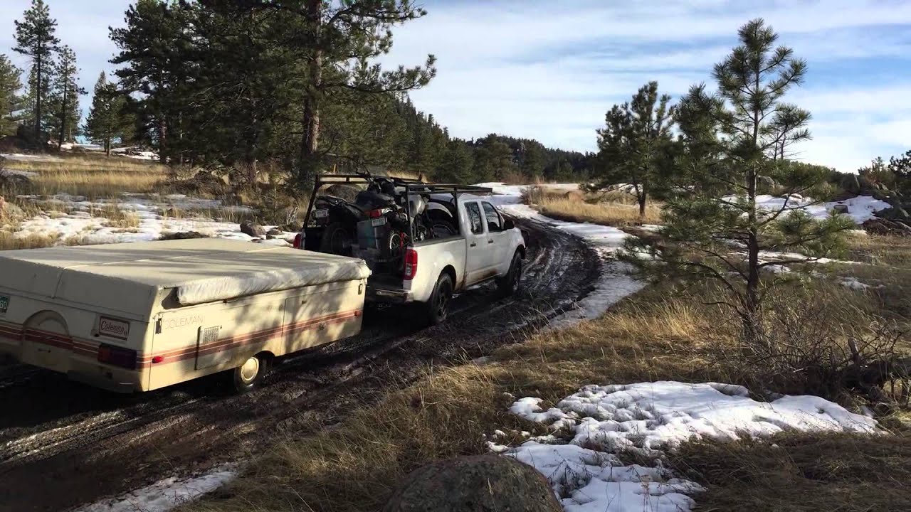 Nissan Frontier tows pop up camper with motorcycles - YouTube