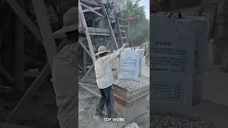 Lifting and Emptying Cement Bags into a Concrete Mixer