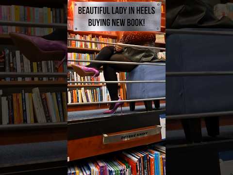 Beautifull lady in high heels buying book, dangling and walking on stairs!