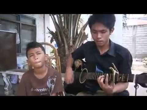 Filipino boy sings Dance With My Father. please share.