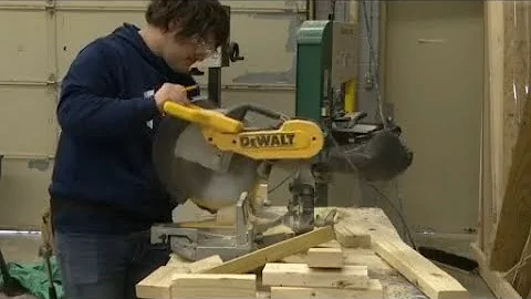 Superior Central students building outhouses for E...