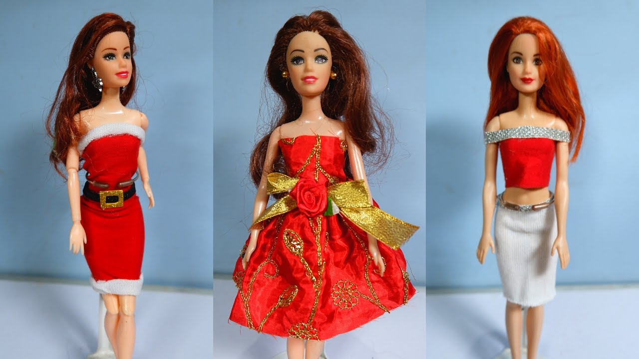 Lot - (4) Barbies including a (1) foreign celebration Barbie - beautiful red  gown - Items loose in box - MIB - Box has minor wear.(1) Dr. Barbie pink  box - NRFB -