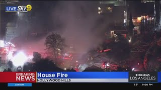 Fire Crews Work To Extinguish Blaze At Hollywood Hills Home