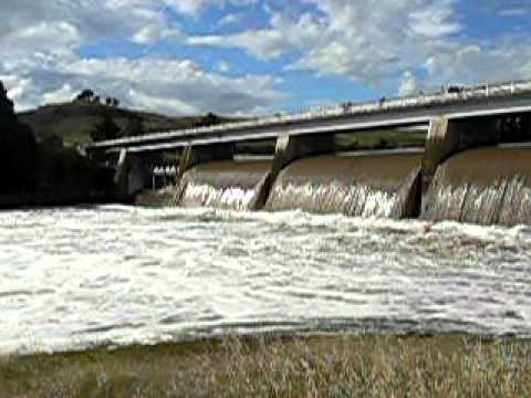 3 flood gates open (out of the five) on Scrivener Dam, Canberra, Australia on the afternoon of 12 December 2010, following severe flooding of the Molonglo River.