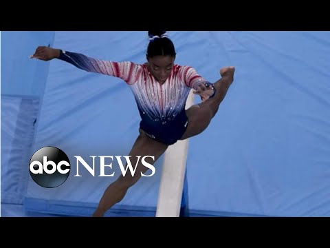 Simone Biles says she wasn’t expecting to medal after winning bronze on balance beam.