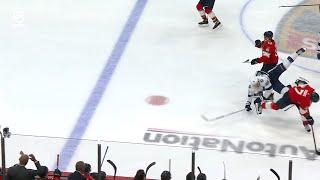 Radko Gudas lays a hit on Mikhail Sergachev