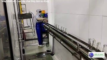 Dây chuyền chiết rót - ren nắp chai nước ngọt tự động, năng suất 2500 chai/h Điện Cơ Xanh 0984467870