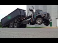 Roll Off truck picking up a heavy load