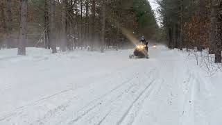 Snowmobiles on the trail.