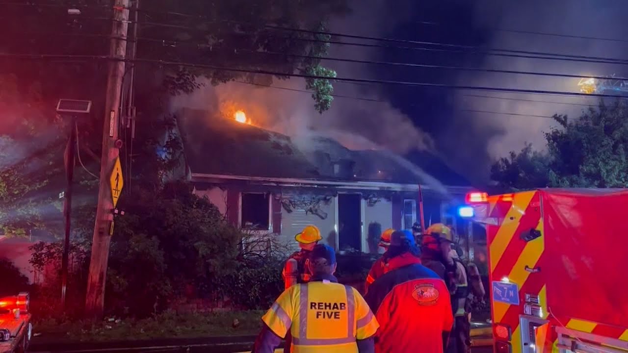 Woman dies after being rescued from burning North Shore home - YouTube