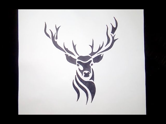 Fine line style deer head tattoo located on the tricep