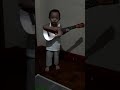 1 year old and 11 mos Joshua sings Happy Birthday with his guitar