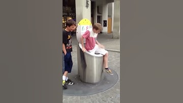 Kid falls down trash compactor