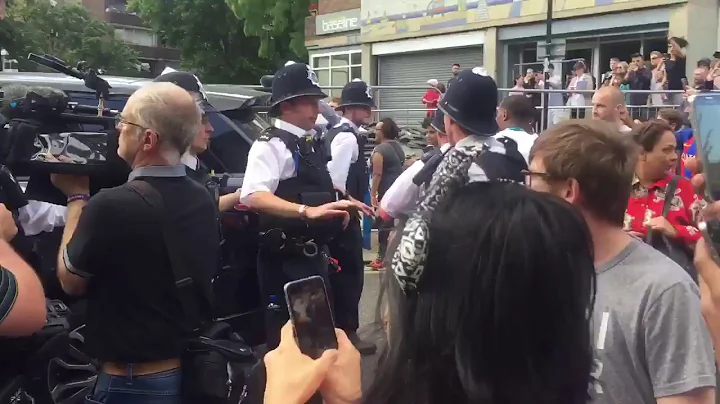 Theresa May leaves St Clements Church as angry pro...