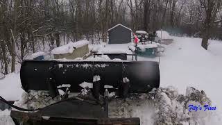 Bobcat T590 plowing snow