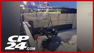 Woman taken to hospital after driving vehicle into 11-metre-deep construction pit