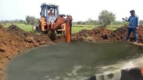 JCB Backhoe Collecting Gravel and JCB KI KHUDAI - JCB Machine Working on Crusher