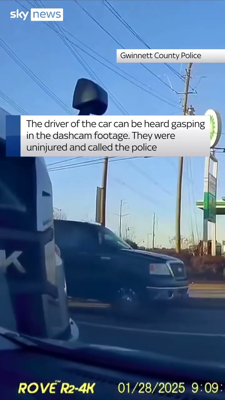 Truck hits car and pushes it along road
