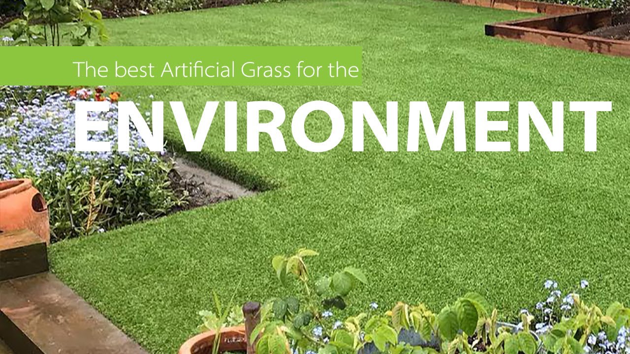 Professional team laying fresh turf in a residential garden