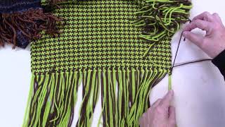 Weaving decorative fringe weft finish