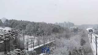 First Snow in Gyeonggi (near Seoul), Korea. View from high road bridge next to train track. Ambience