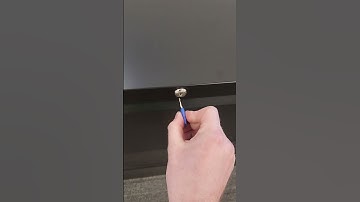 Marty unlocks a lateral filing cabinet with a master key