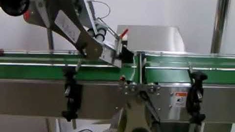 Loynds top and bottom label machine.wmv