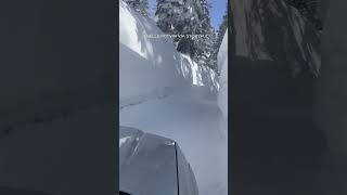 Lake Tahoe resident drives past walls of snow