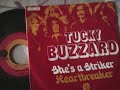 Tucky Buzzard - She's A Striker + He.