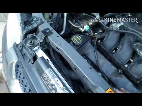 Video: Unde este capacul radiatorului unui Ford Escape 2004?