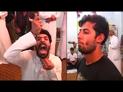 Iraq's Sufis remember God through bizarre body piercing ritual