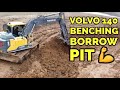 Volvo 140 Excavator moving dirt in a borrow pit - PLUS - unique tow on the Ohio River