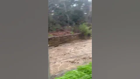 Flash Flooding Turns California Creek into Rushing...