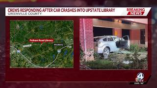 Crews responding after a car crashed into a library in Greenville County