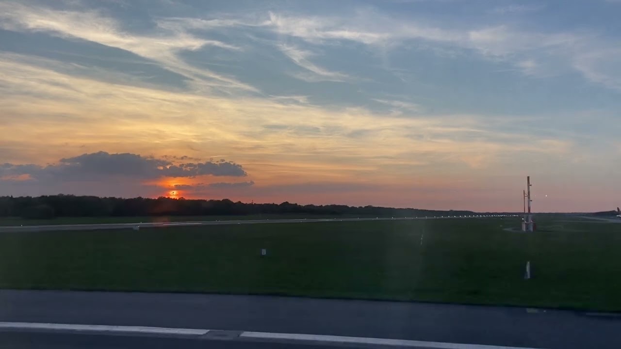 Hamburg - Takeoff into red sunset over the Elbe river 