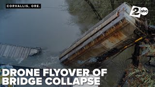 Drone flyover of the bridge collapse in Corvallis. Officials say they will remove the train car soon