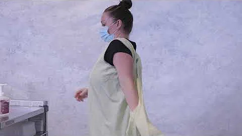 Donning and doffing reusable wraparound cloth isolation gowns