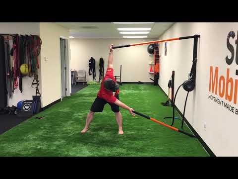 thoracic-spine-rotation-wall-drill---stick-mobility-exercise