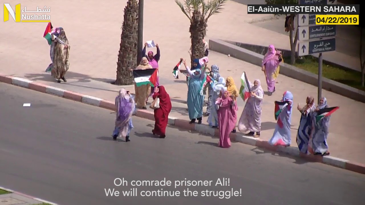 Sahrawi Demonstrators Raising WESTERN SAHARA's flags in Solidarity with the Detainee Ali Saadouni.