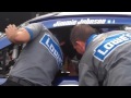 Crew members work on 48 car of NASCAR points leader Jimmie Johnson at Michigan International Speedwa